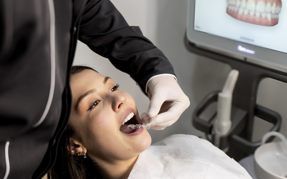 Dentist taking a digital scan of a patient's teeth