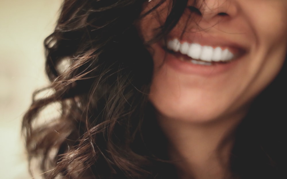 Woman smiling after professional teeth whitening