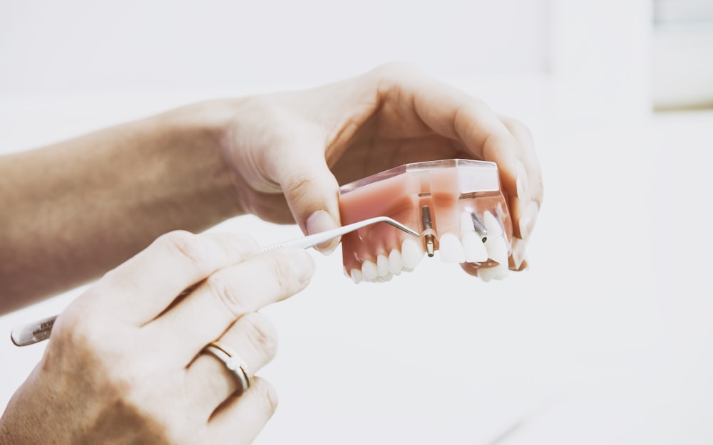 Dental technician holding a zirconia restoration